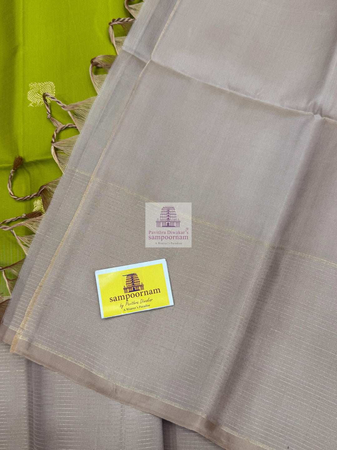 Pastel Green with Beige , Zari lines in the border , Annam and Chakram butta in the body and rich Pallu Pure Soft Silk Saree