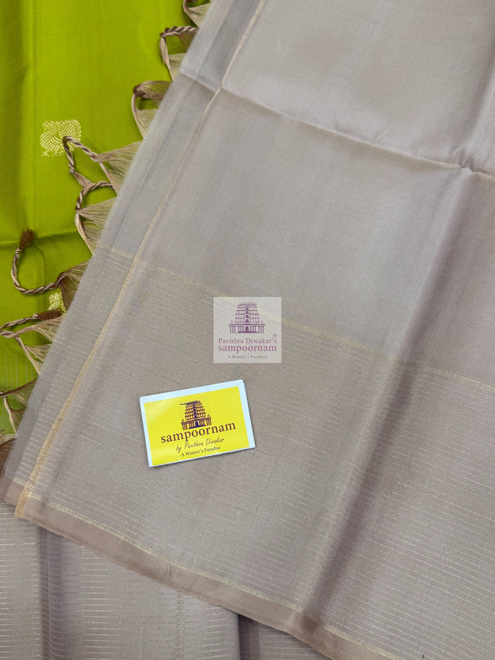 Pastel Green with Beige , Zari lines in the border , Annam and Chakram butta in the body and rich Pallu Pure Soft Silk Saree