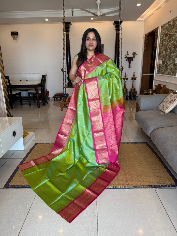 Pastel Green with Pink with rich leaf zari motif in the body , kanchi borders and rich Pallu , pure soft silk saree