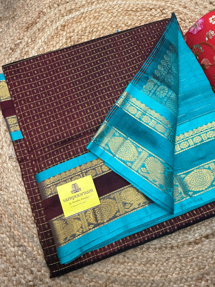 Dark Arakku with Turquoise Blue , Zari  butta in the body , rettapet  border and rich Pallu Lakshadeepam Silk Cotton Saree