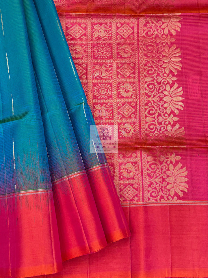 Ramar Green with Orangish Pink , Vairaoosi lines in the border ,  Zari butta in the body and grand  Pallu Pure Soft Silk Saree