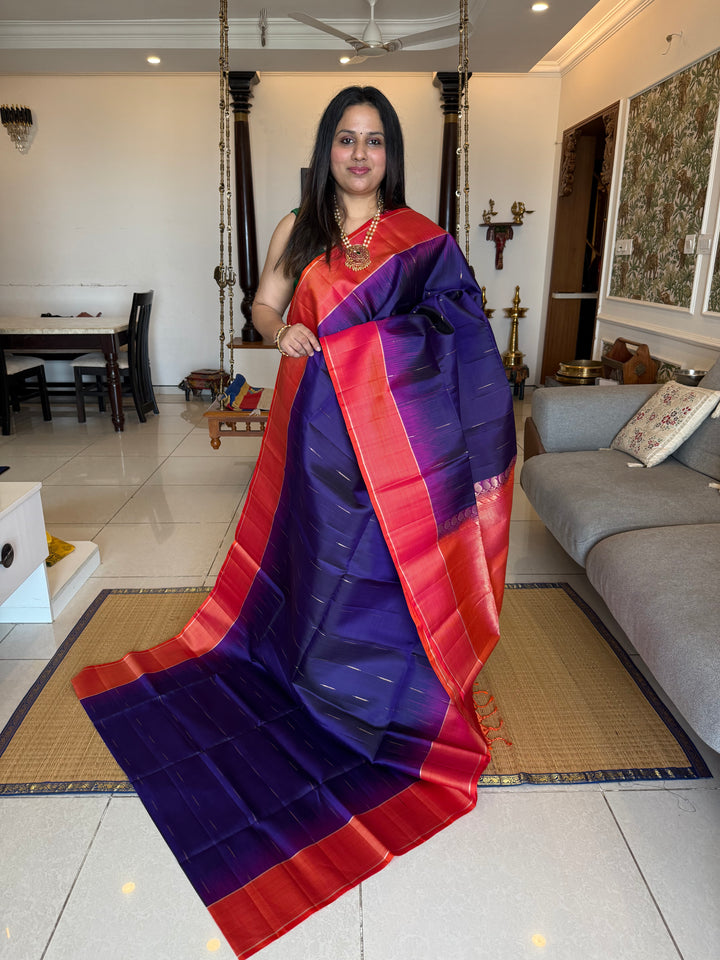 Indigo Blue with Orangish Pink raindrop zari motif in the body , vairaoosi borders and rich Pallu , pure soft silk saree