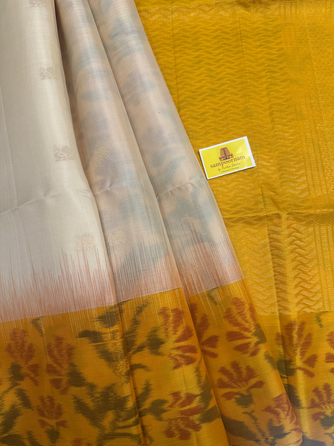 Offwhite with Yellow , Pochampally borders and blouse , Zari Mayil butta in the body and rich Pallu , pure soft silk saree