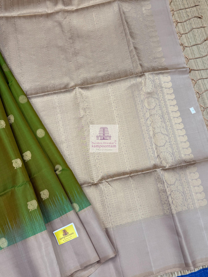 Manthulir Green with Beige ,  Vairaoosi lines in the border , Annam and Chakram butta in the body and rich Pallu Pure Soft Silk Saree