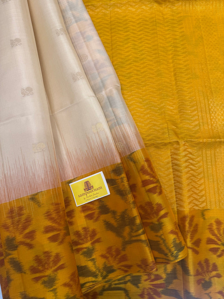 Offwhite with Yellow , Pochampally borders and blouse , Zari Mayil butta in the body and rich Pallu , pure soft silk saree