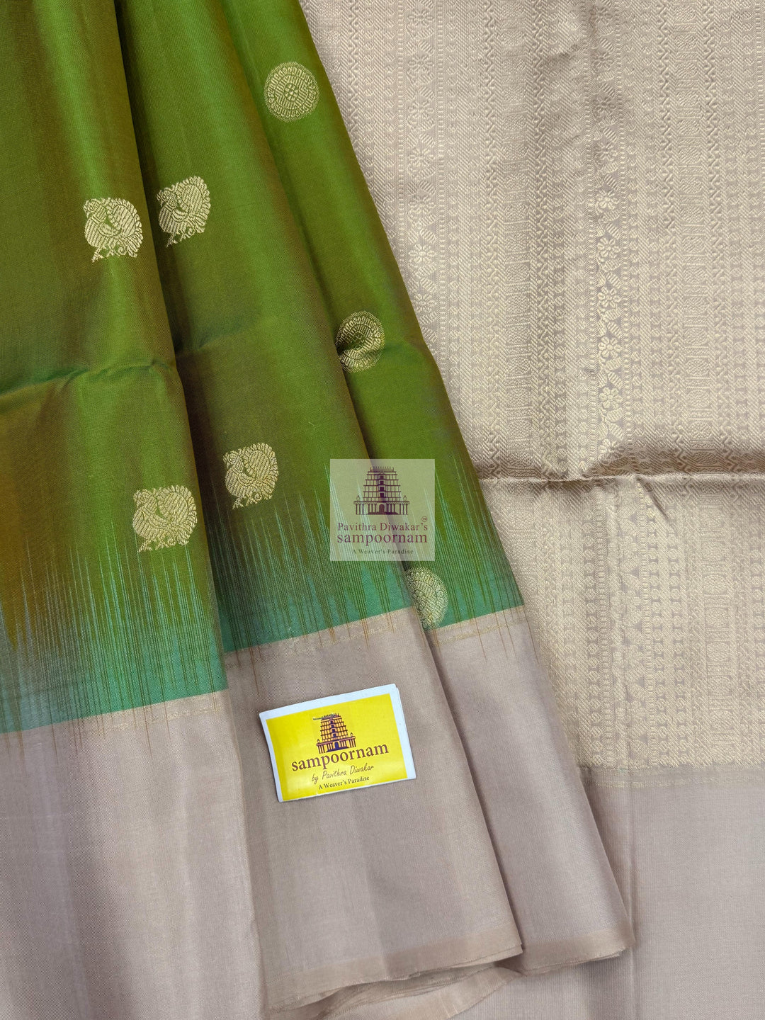 Manthulir Green with Beige ,  Vairaoosi lines in the border , Annam and Chakram butta in the body and rich Pallu Pure Soft Silk Saree