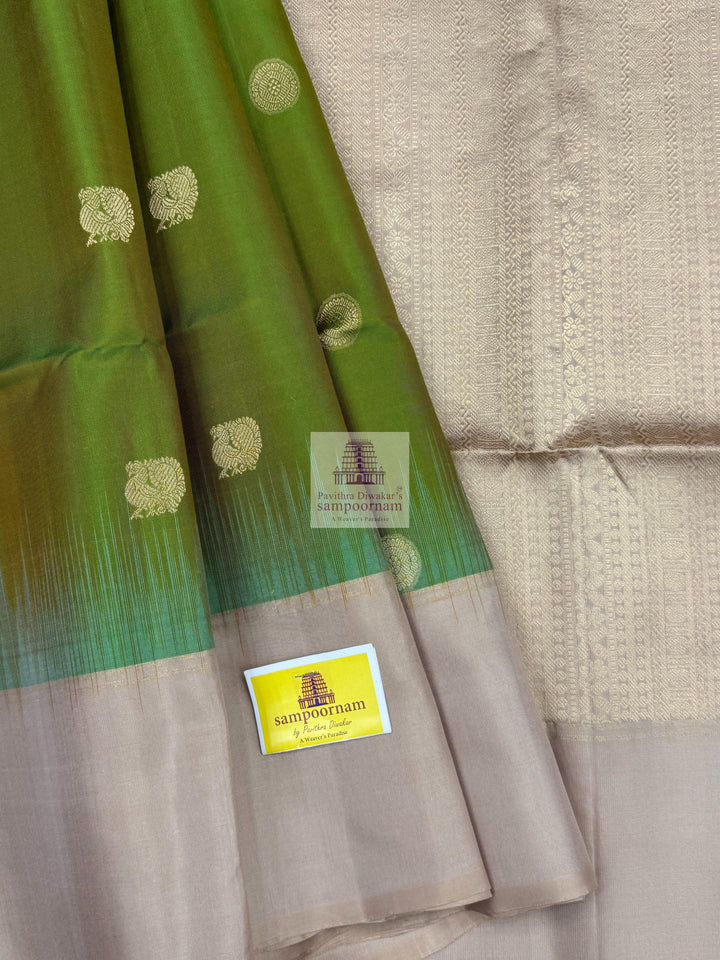 Manthulir Green with Beige ,  Vairaoosi lines in the border , Annam and Chakram butta in the body and rich Pallu Pure Soft Silk Saree
