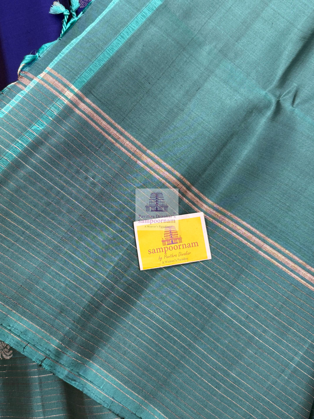 Dark Blue with Teel Blue ,  Zari lines in the border , Annam and Chakram butta in the body and rich Pallu Pure Soft Silk Saree