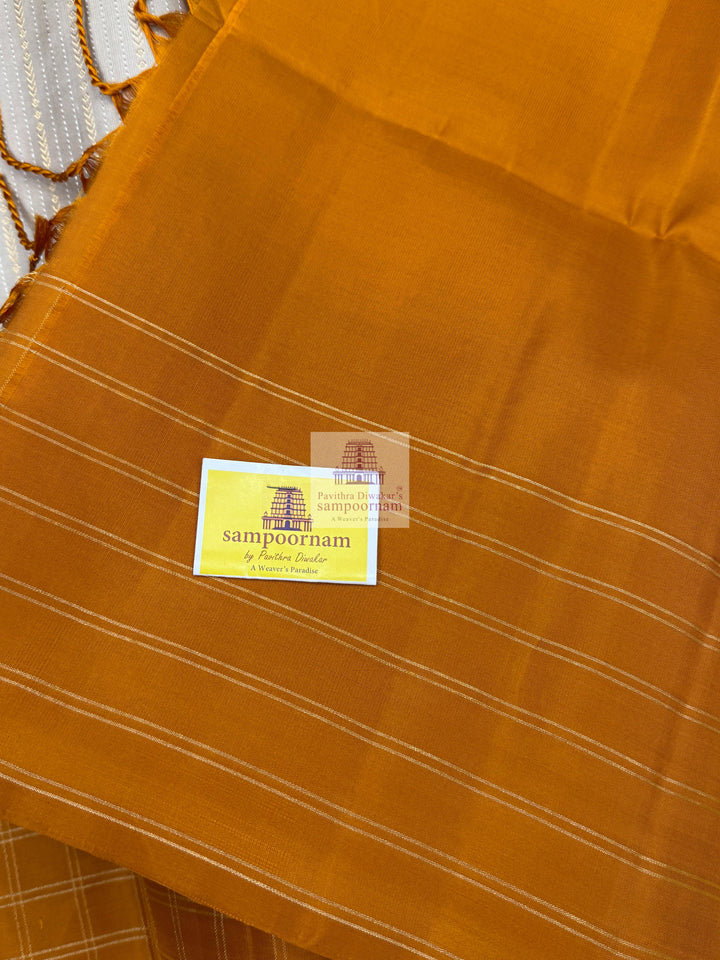 Mustard with Beige , Zari checks in the border , Vertical Gold and Silver lines in the body and rich Pallu Pure Soft Silk Saree