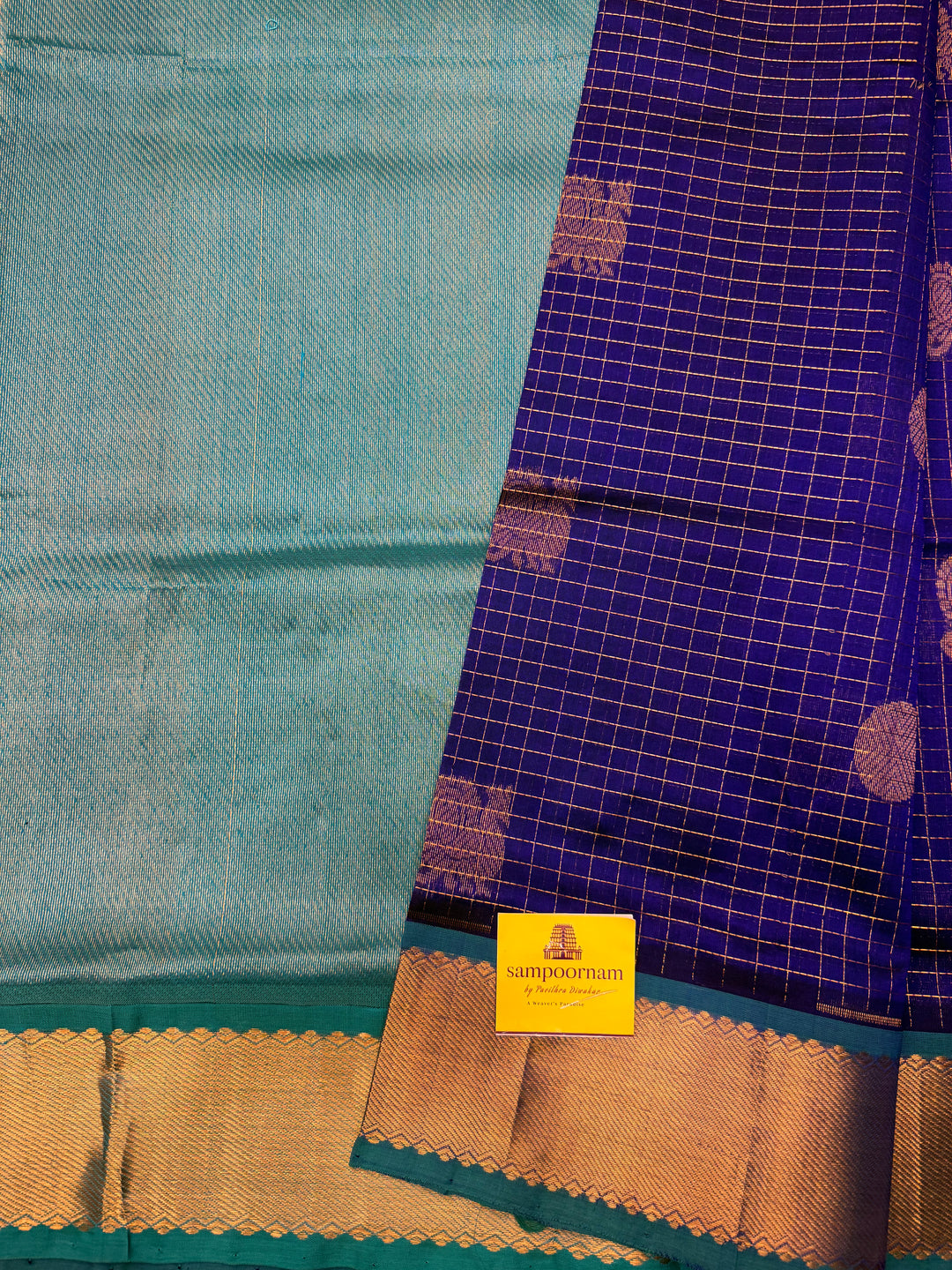 Blue with Turquoise Blue , Zari Checks with  Mayil and  Chakram Butta in the Body, Traditional Borders and Rich Pallu Mayil Chakram Silk Cotton Saree