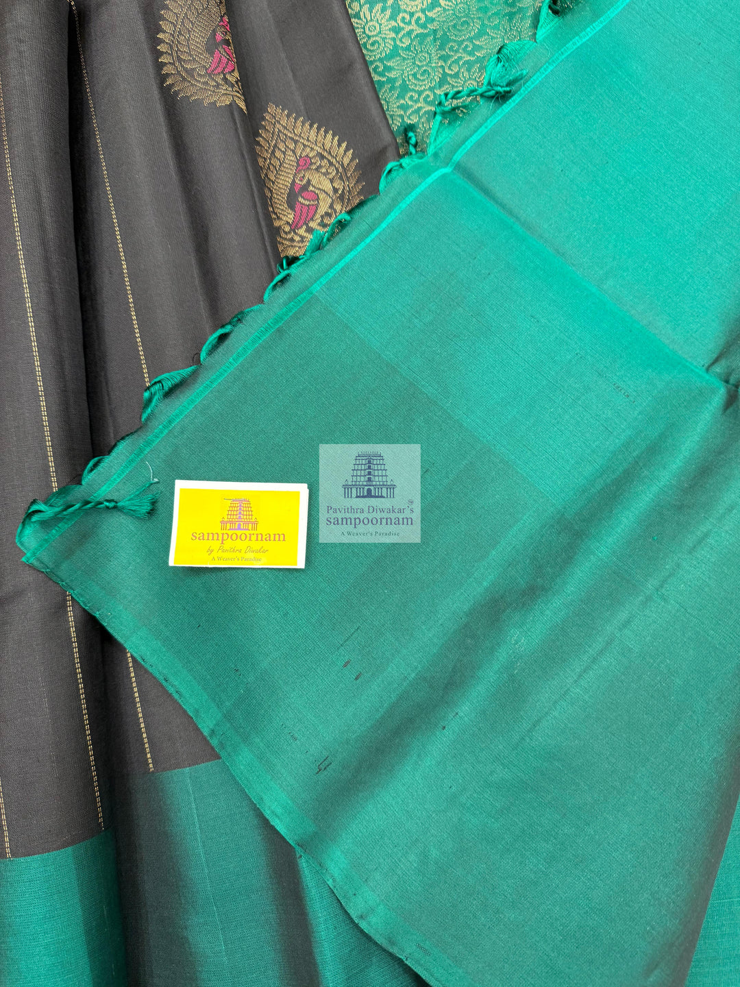 Black with Green , rich Zari butta in the body , rettapet border and grand  Pallu Pure Soft Silk Saree