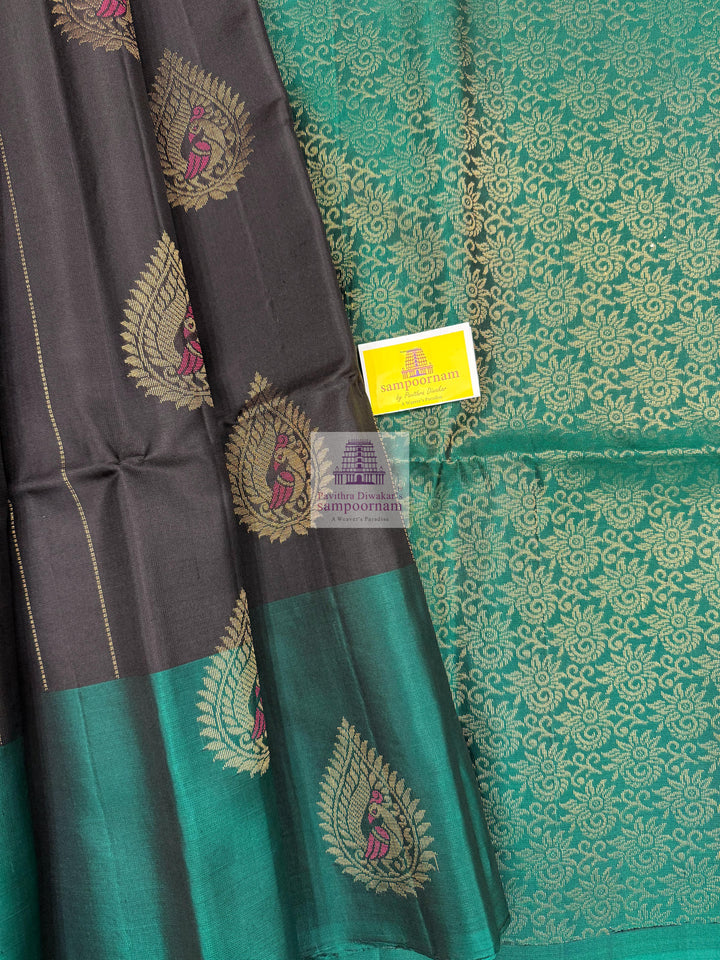 Black with Green , rich Zari butta in the body , rettapet border and grand  Pallu Pure Soft Silk Saree