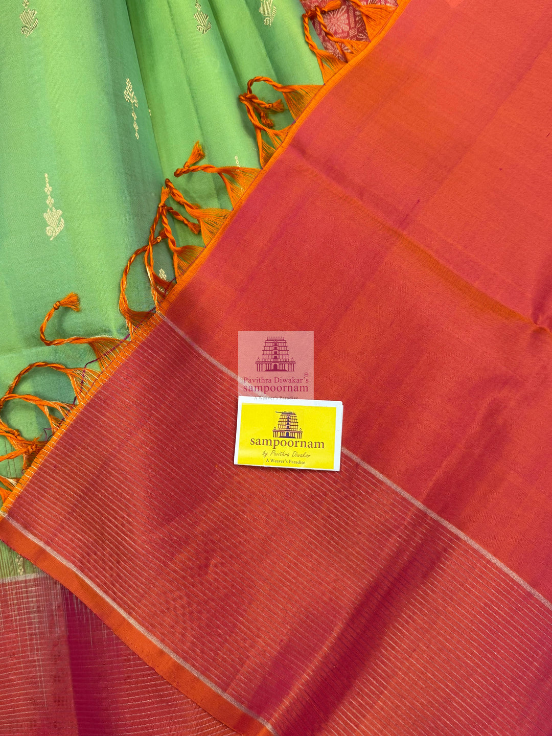 Pastel Green with Orangish Pink , Vairaoosi lines in the border , rich butta in the body Mambazha Manjal with Black , one side big border , rich Zari butta in the body and grand  Pallu Pure Soft Silk Saree
