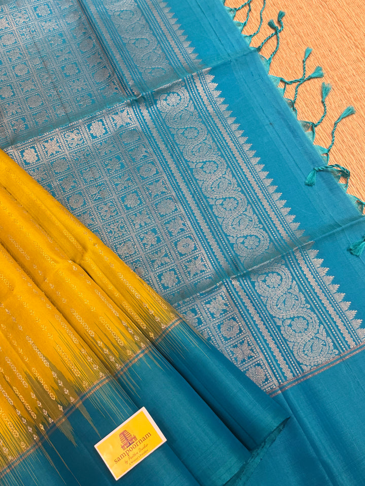 Lemon Yellow with Turquoise Blue rich Zari butta in silver and gold zari in the body , plain border and rich Pallu , pure soft silk saree