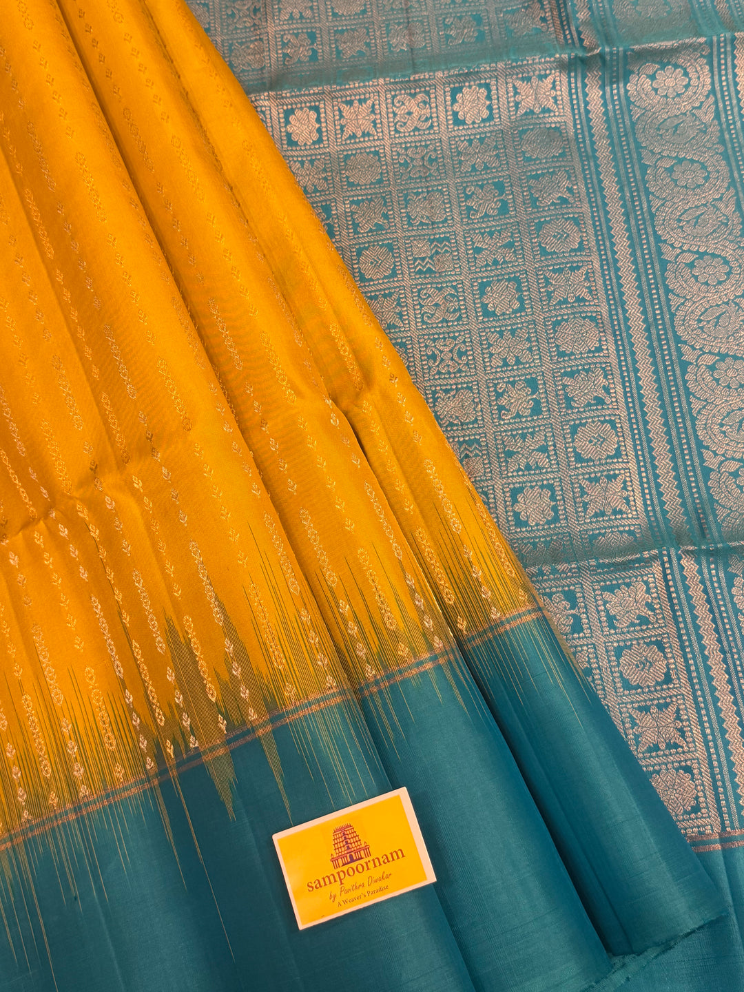 Lemon Yellow with Turquoise Blue rich Zari butta in silver and gold zari in the body , plain border and rich Pallu , pure soft silk saree
