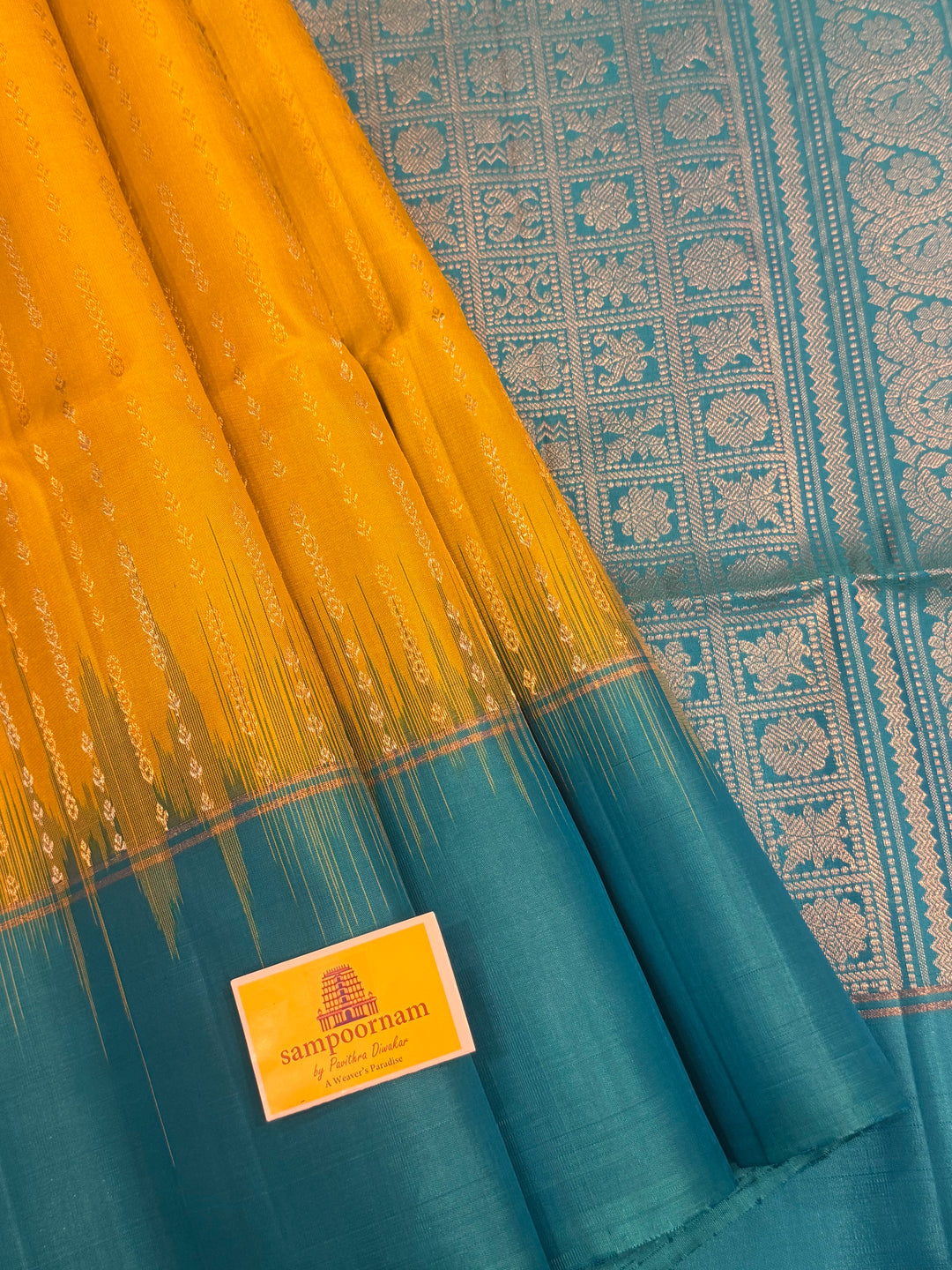 Lemon Yellow with Turquoise Blue rich Zari butta in silver and gold zari in the body , plain border and rich Pallu , pure soft silk saree