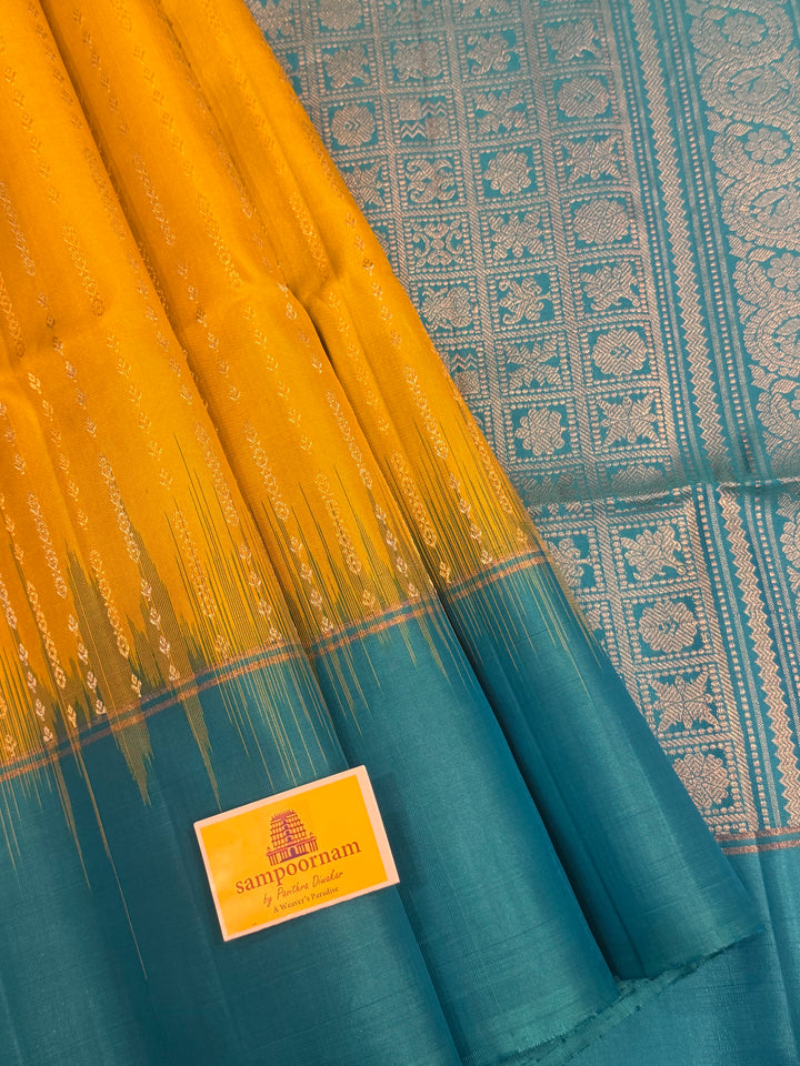 Lemon Yellow with Turquoise Blue rich Zari butta in silver and gold zari in the body , plain border and rich Pallu , pure soft silk saree