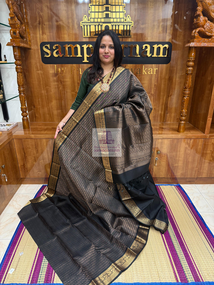 Black colour with Floral Banarasi rich Zari butta and Grand Gold Zari border Pure Soft Silk Saree