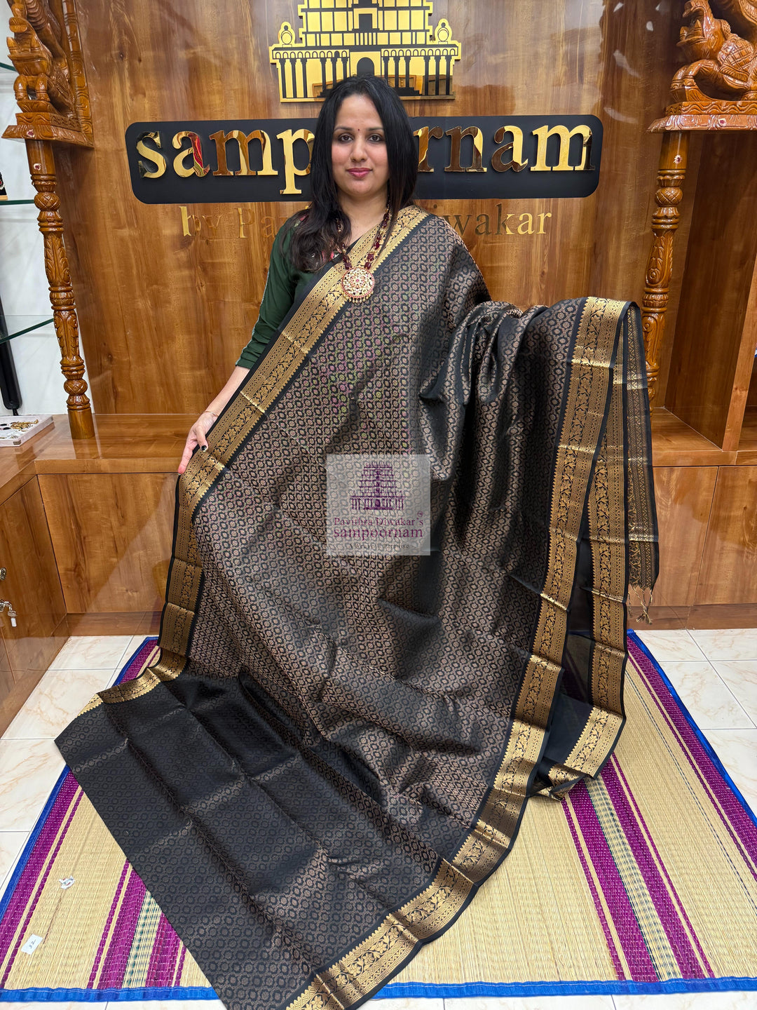 Black colour with Floral Banarasi rich Zari butta and Grand Gold Zari border Pure Soft Silk Saree