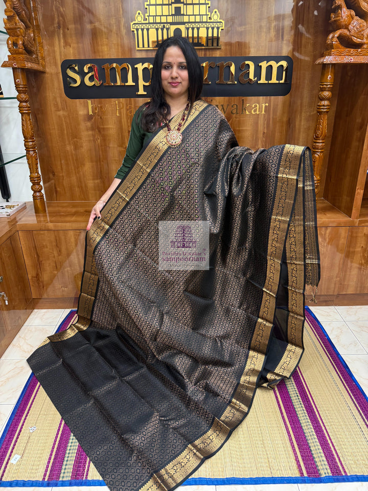 Black colour with Floral Banarasi rich Zari butta and Grand Gold Zari border Pure Soft Silk Saree