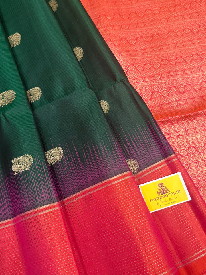 Dark Green with Pinkish Orange , rich zari annam and rudraksh butta in the body , vairaoosi borders and rich Pallu , pure soft silk saree