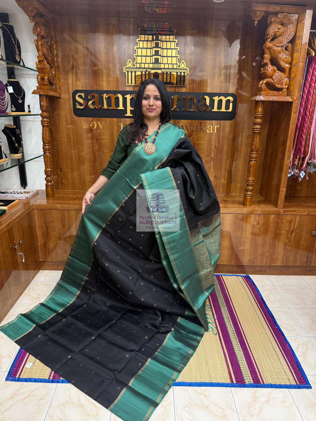 Black with Sage Green , Vairaoosi lines in the border , Floral Zari butta in the body and grand  Pallu Pure Soft Silk Saree