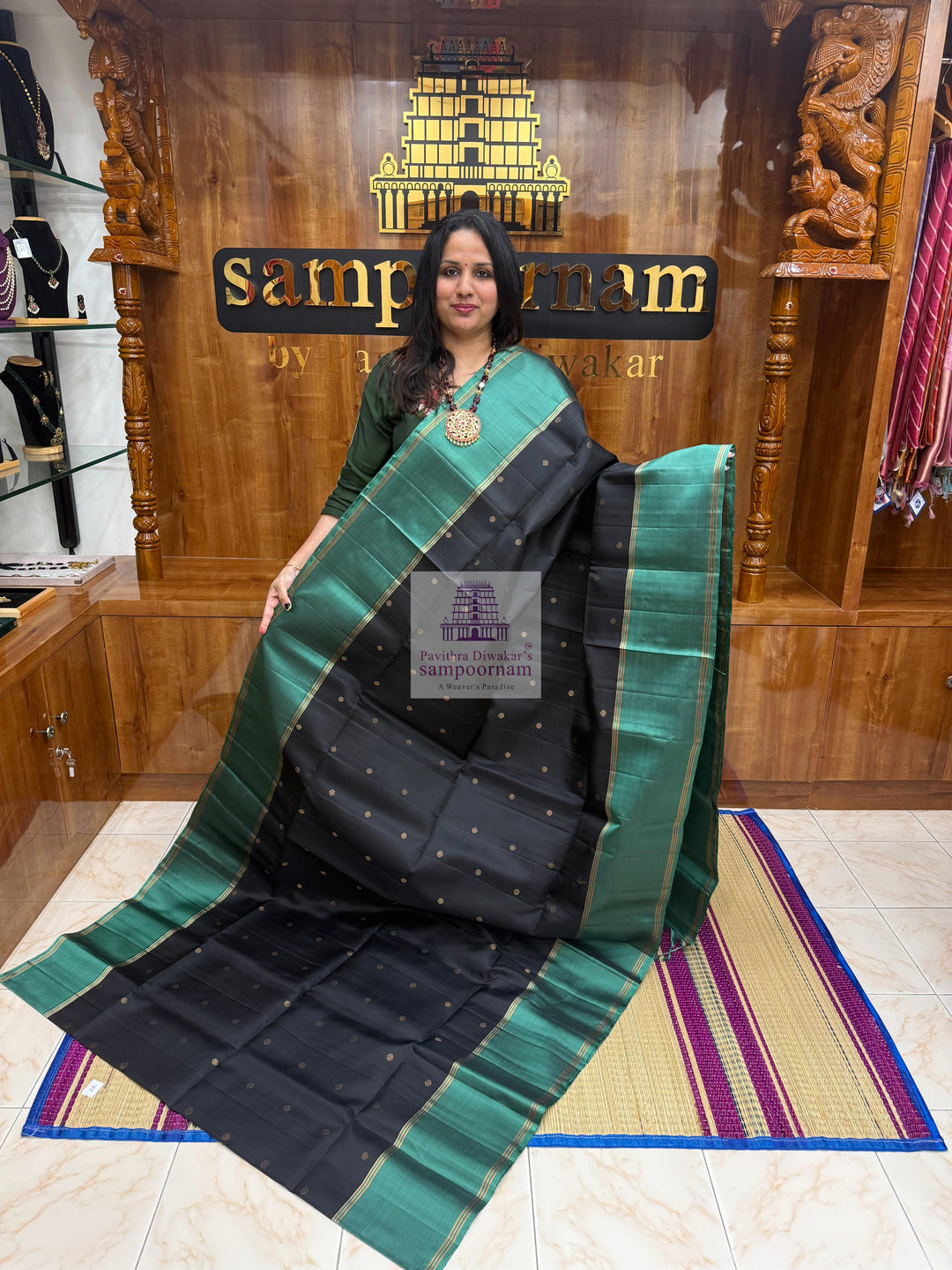 Black with Sage Green , Vairaoosi lines in the border , Floral Zari butta in the body and grand  Pallu Pure Soft Silk Saree