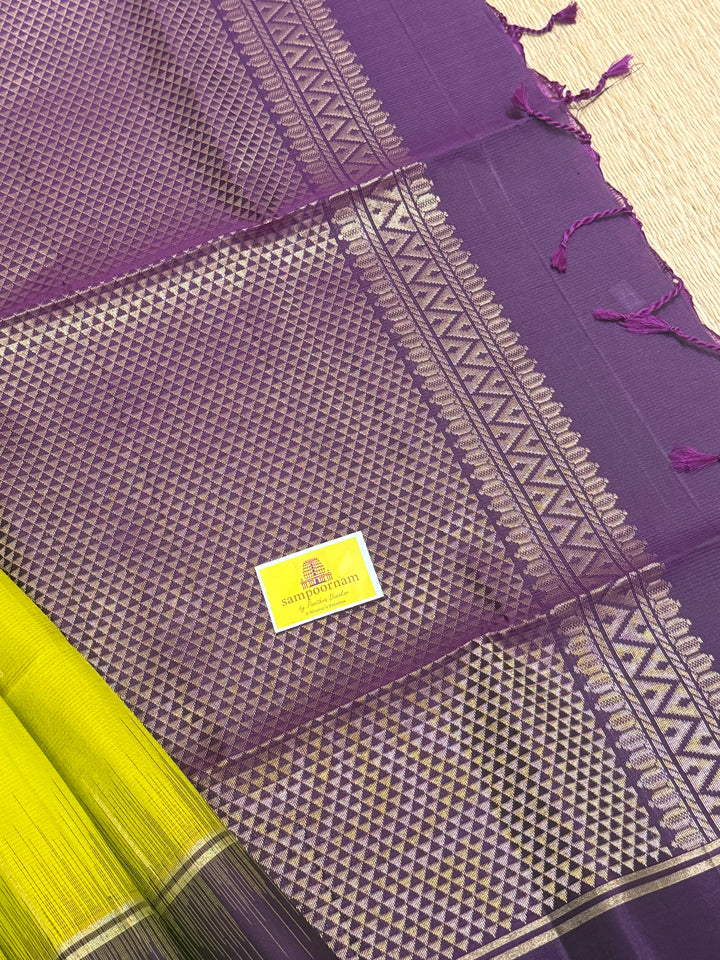 Lemon Yellow with Purple , rain drop zari butta in the body , plain borders and rich Pallu , pure soft silk saree