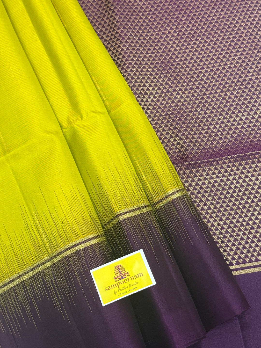 Lemon Yellow with Purple , rain drop zari butta in the body , plain borders and rich Pallu , pure soft silk saree