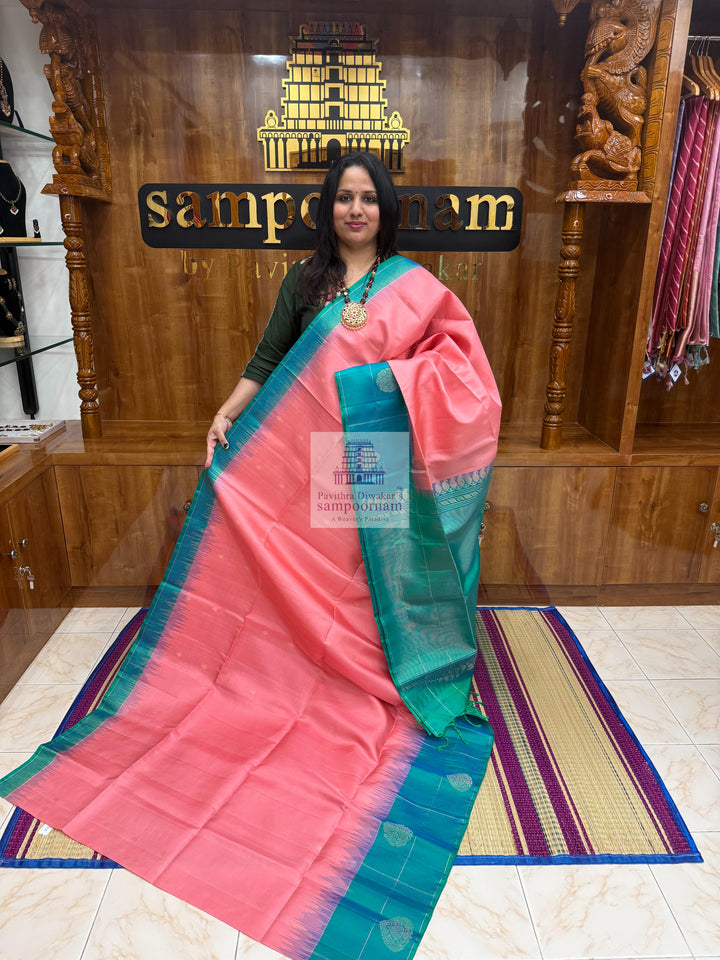 Baby Pink with Green , Vairaoosi lines in the border , rich Zari butta in the body and grand  Pallu Pure Soft Silk Saree