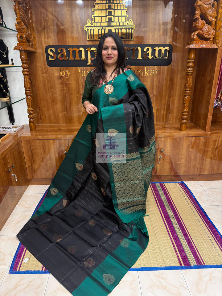 Black with Green , rich Zari butta in the body , rettapet border and grand  Pallu Pure Soft Silk Saree