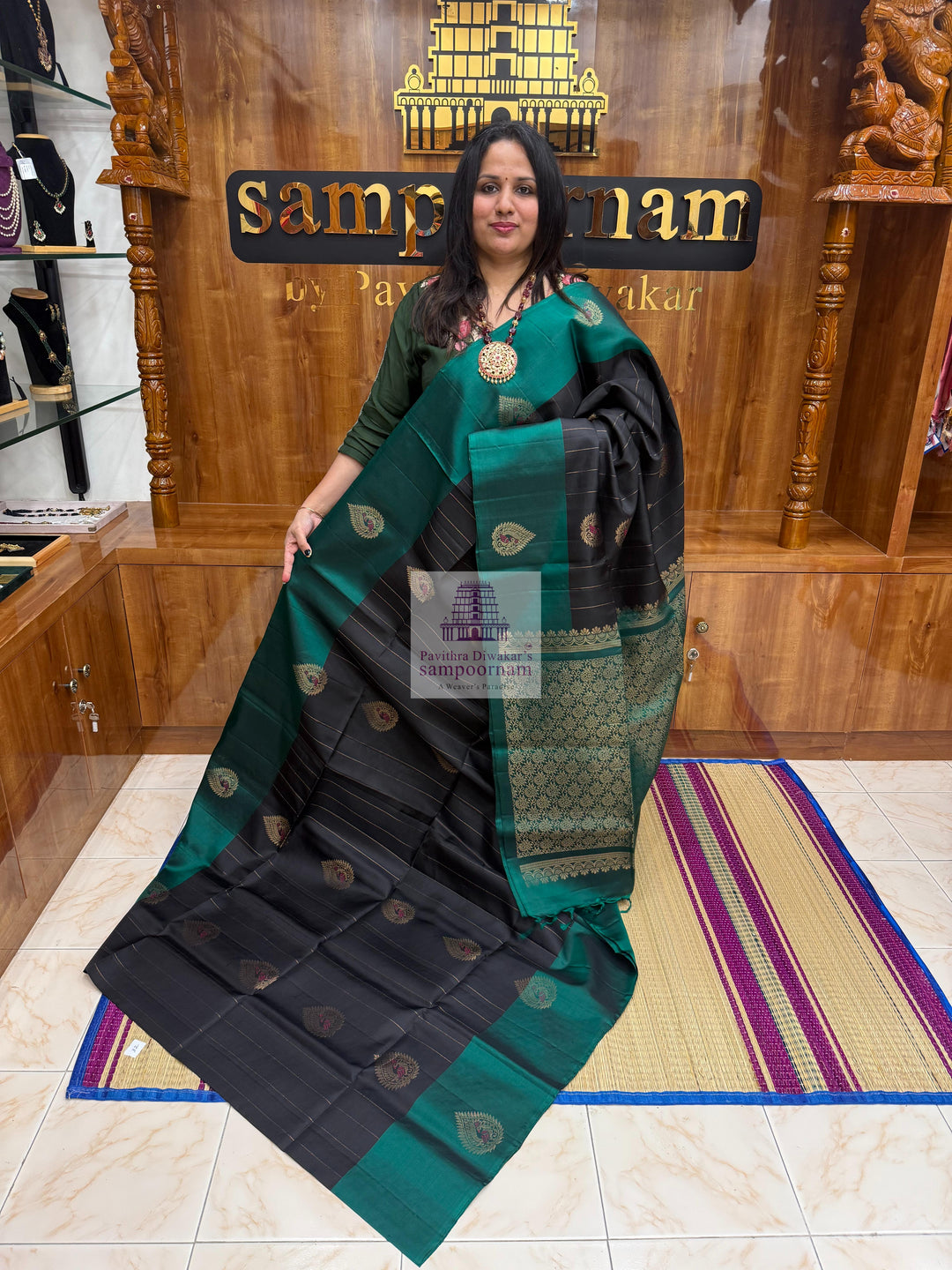 Black with Green , rich Zari butta in the body , rettapet border and grand  Pallu Pure Soft Silk Saree