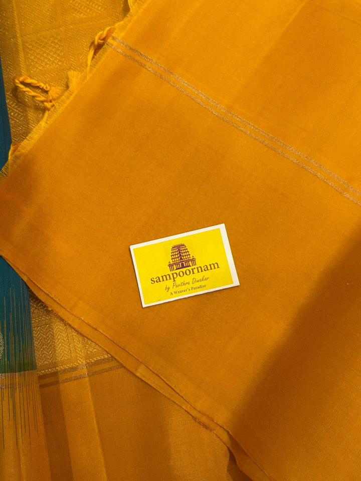 Greenish Blue with Manjal , rich zari rudraksh butta in the body , plain borders and rich Pallu , pure soft silk saree