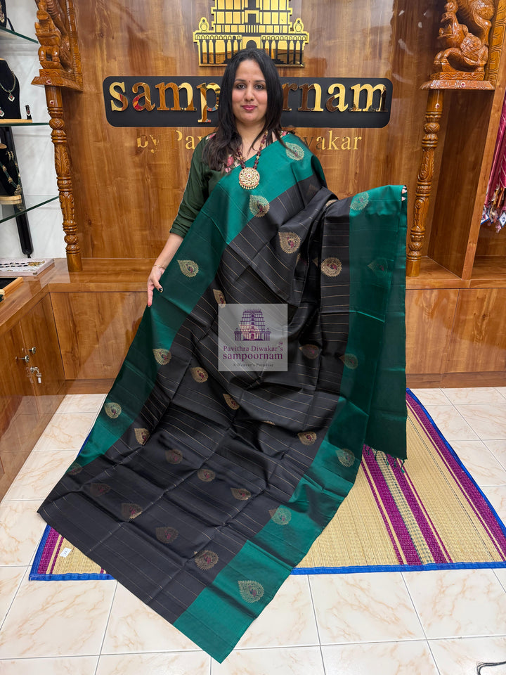 Black with Green , rich Zari butta in the body , rettapet border and grand  Pallu Pure Soft Silk Saree