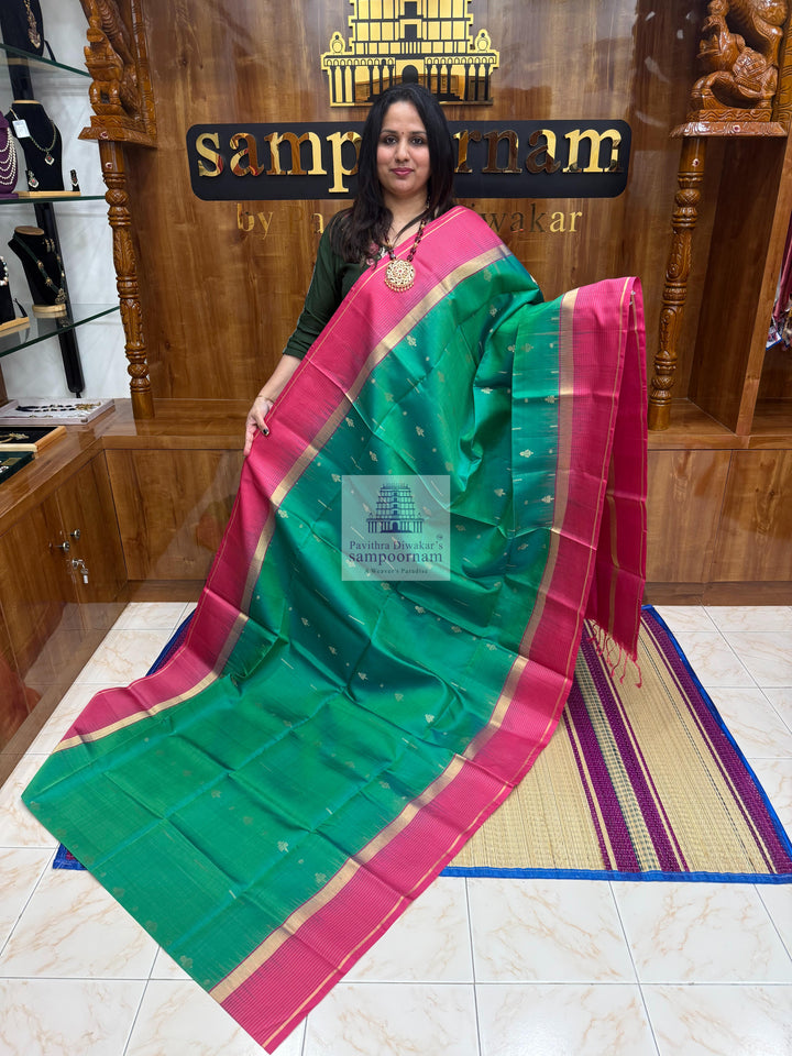 Ramar Green with Pink , Vairaoosi lines in the border , rich Zari butta in the body and grand  Pallu Pure Soft Silk Saree