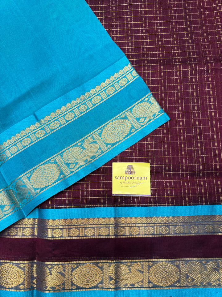 Dark Arakku with Turquoise Blue , Zari  butta in the body , rettapet  border and rich Pallu Lakshadeepam Silk Cotton Saree