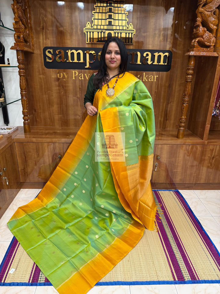 Pastel Green with Mustard ,  Vairaoosi lines in the border , Annam and Chakram butta in the body and rich Pallu Pure Soft Silk Saree