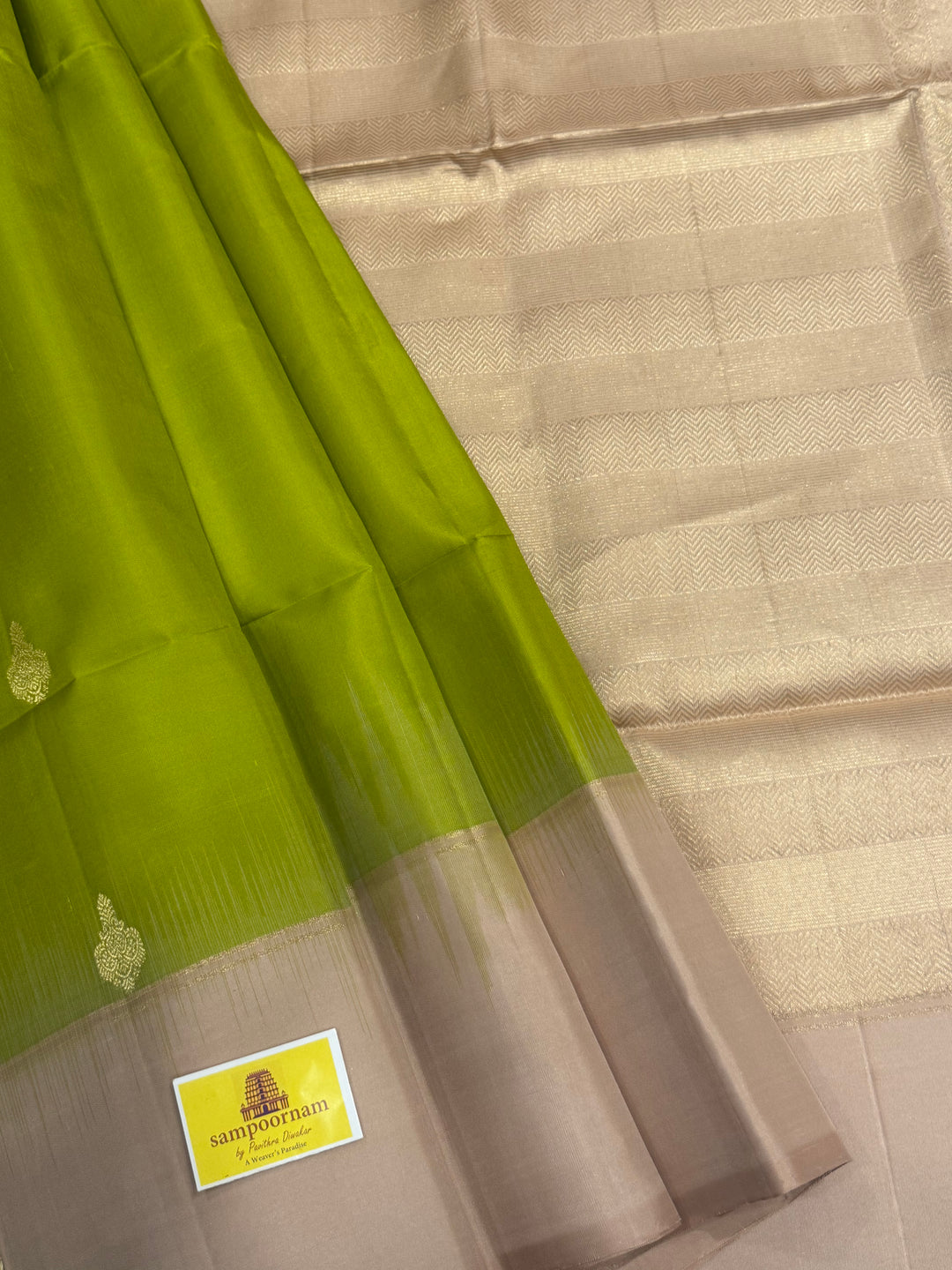 Light Green with Beige rich zari butta in the body , plain borders and rich Pallu , pure soft silk saree