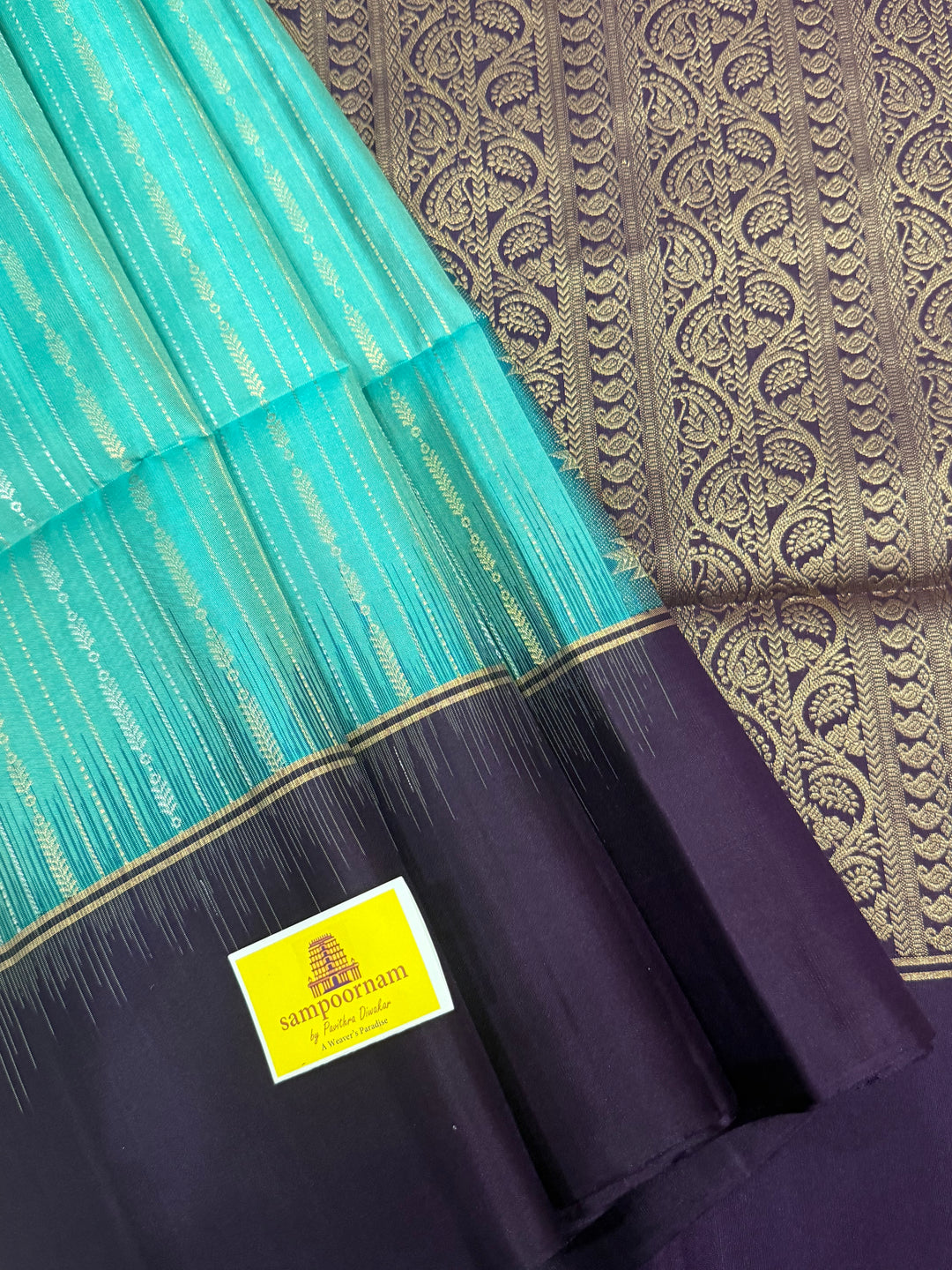 Pastel Light Blue with Purple , rich zari gold and silver zari butta in the body and grand  Pallu , pure soft silk saree