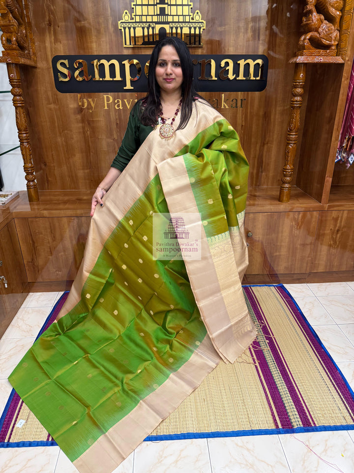Manthulir Green with Beige ,  Vairaoosi lines in the border , Annam and Chakram butta in the body and rich Pallu Pure Soft Silk Saree