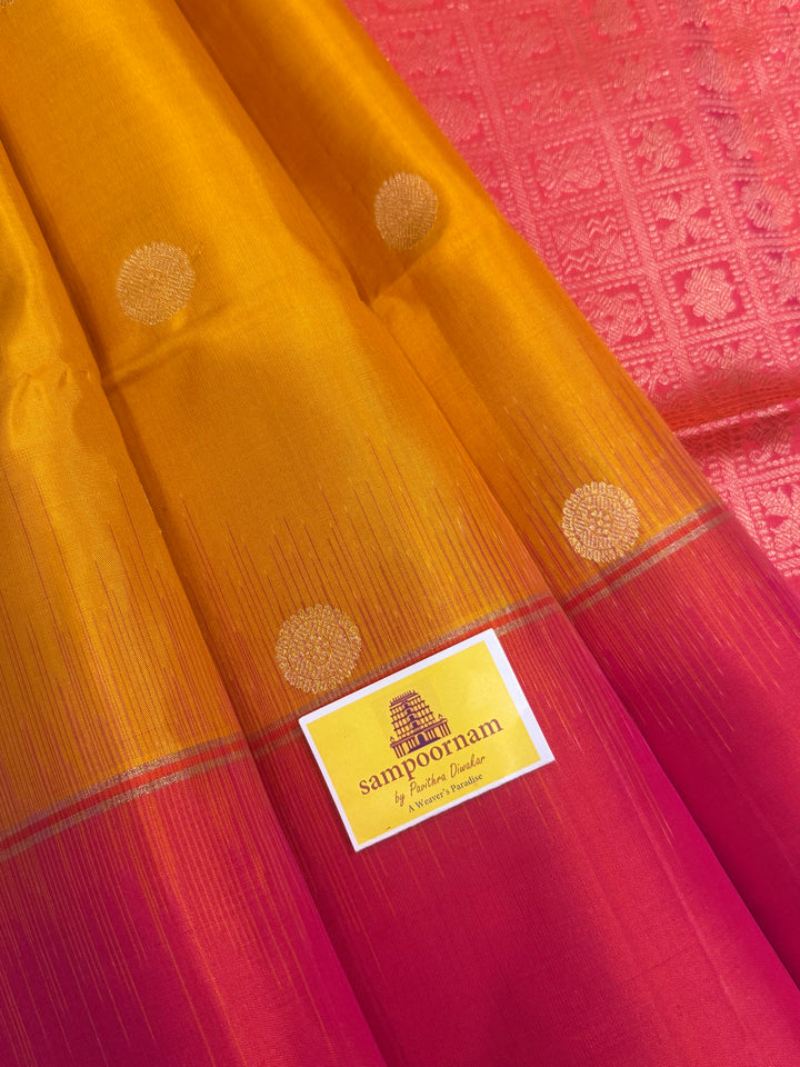 Manjal with Reddish Pink , rich zari checks in the body , vairaoosi lines in the border and rich Pallu , pure soft silk saree