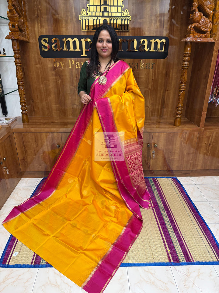 Mambazha Manjal with Rani Pink  , rich Zari butta in the body , rettapet boder  and grand  Pallu Pure Soft Silk Saree