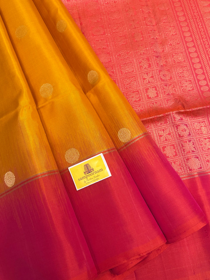 Manjal with Reddish Pink , rich zari checks in the body , vairaoosi lines in the border and rich Pallu , pure soft silk saree