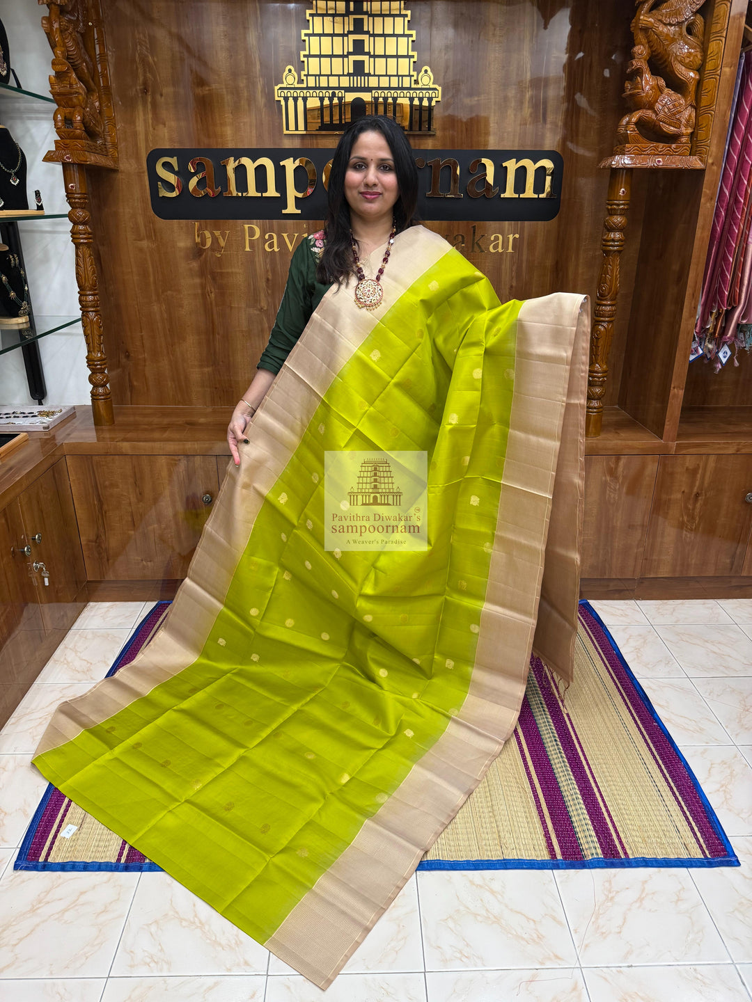 Pastel Green with Beige , Zari lines in the border , Annam and Chakram butta in the body and rich Pallu Pure Soft Silk Saree