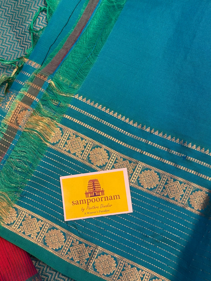Reddish Pink with Turquoise Blue , rettapet border with Veldhari lines and zari butta in the body and grand  Pallu , pure soft silk saree