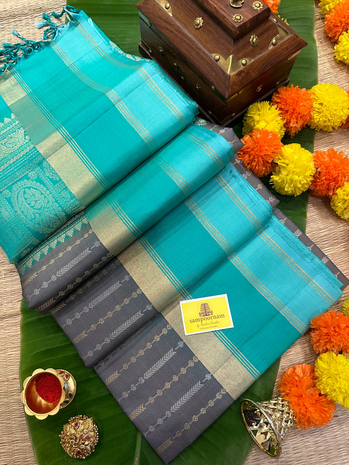 Grey With Sea Green Triple Border, Gold And Silver Zari Lines all over the body And Rich Pallu  Pure Soft Silk Saree