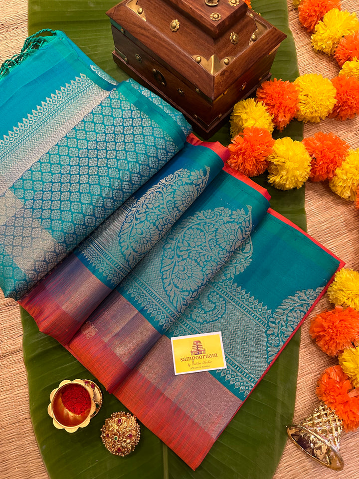 Brick Orange with Turquoise Blue , One Side Big Border , Annam and Flower Zari Motif in the Body and Rich Pallu  Pure Soft Silk Saree