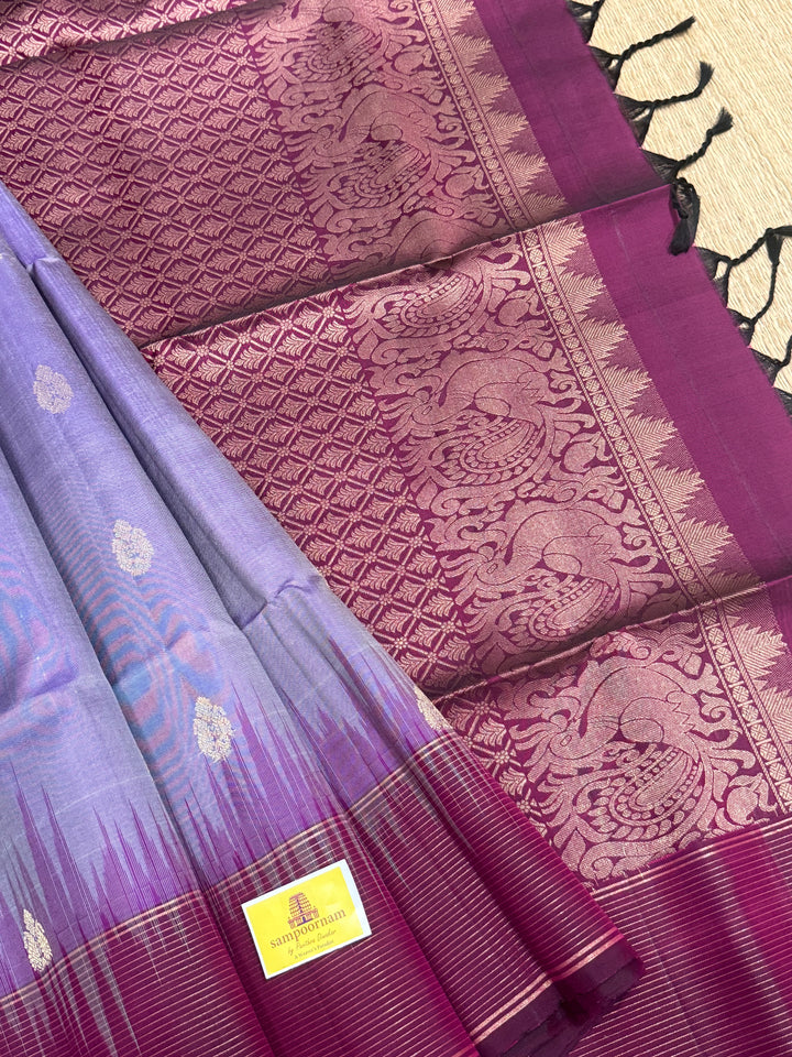 Lavender with Dark Maroon , rich zari butta in the body , vairaoosi lines in the border and rich Pallu , pure soft silk saree