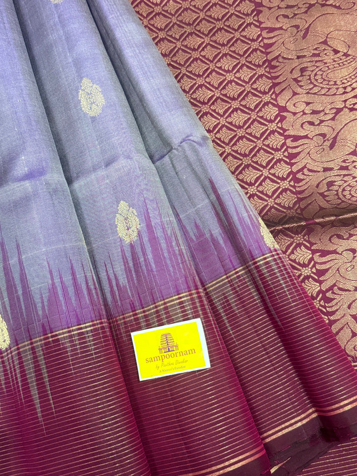 Lavender with Dark Maroon , rich zari butta in the body , vairaoosi lines in the border and rich Pallu , pure soft silk saree