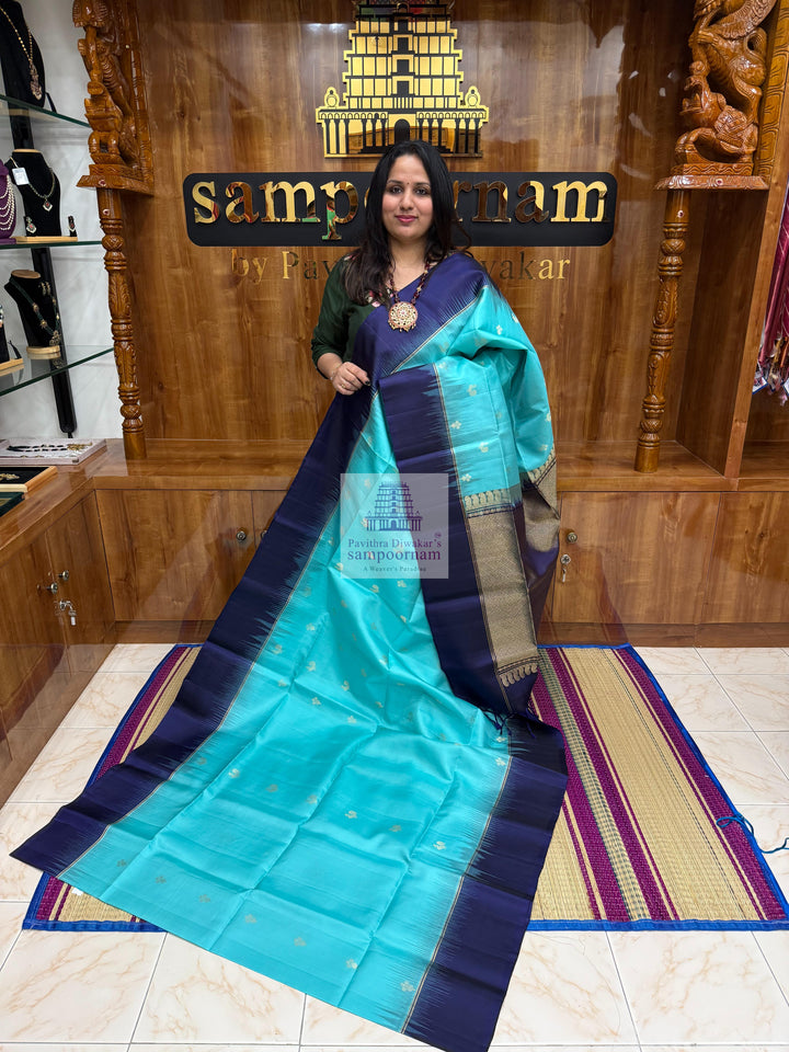 Blue with Dark Blue ,  Vairaoosi lines in the border , Annam and Floral butta in the body and rich Pallu Pure Soft Silk Saree
